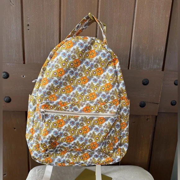 Add some color to your wardrobe with this Floral Orange and Yellow Backpack. - Picture 1 of 10